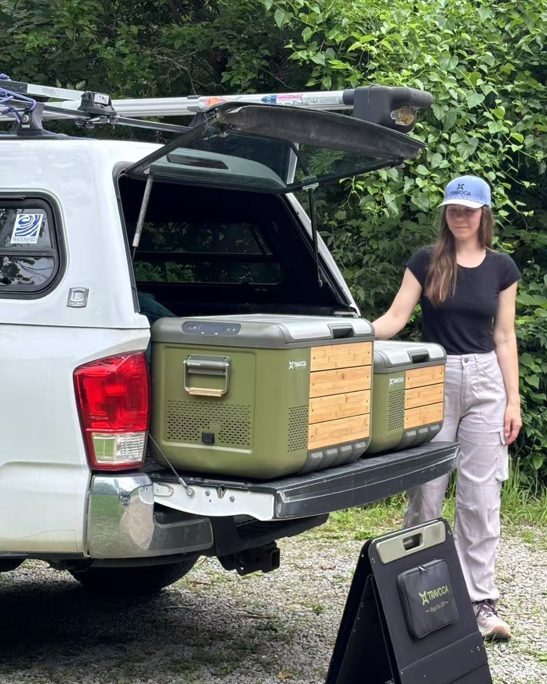 TRAVOCA Rigel 60 and 45 dual zone electric coolers with solar panel displayed at car camping setup, portable fridge freezers powered by solar energy.