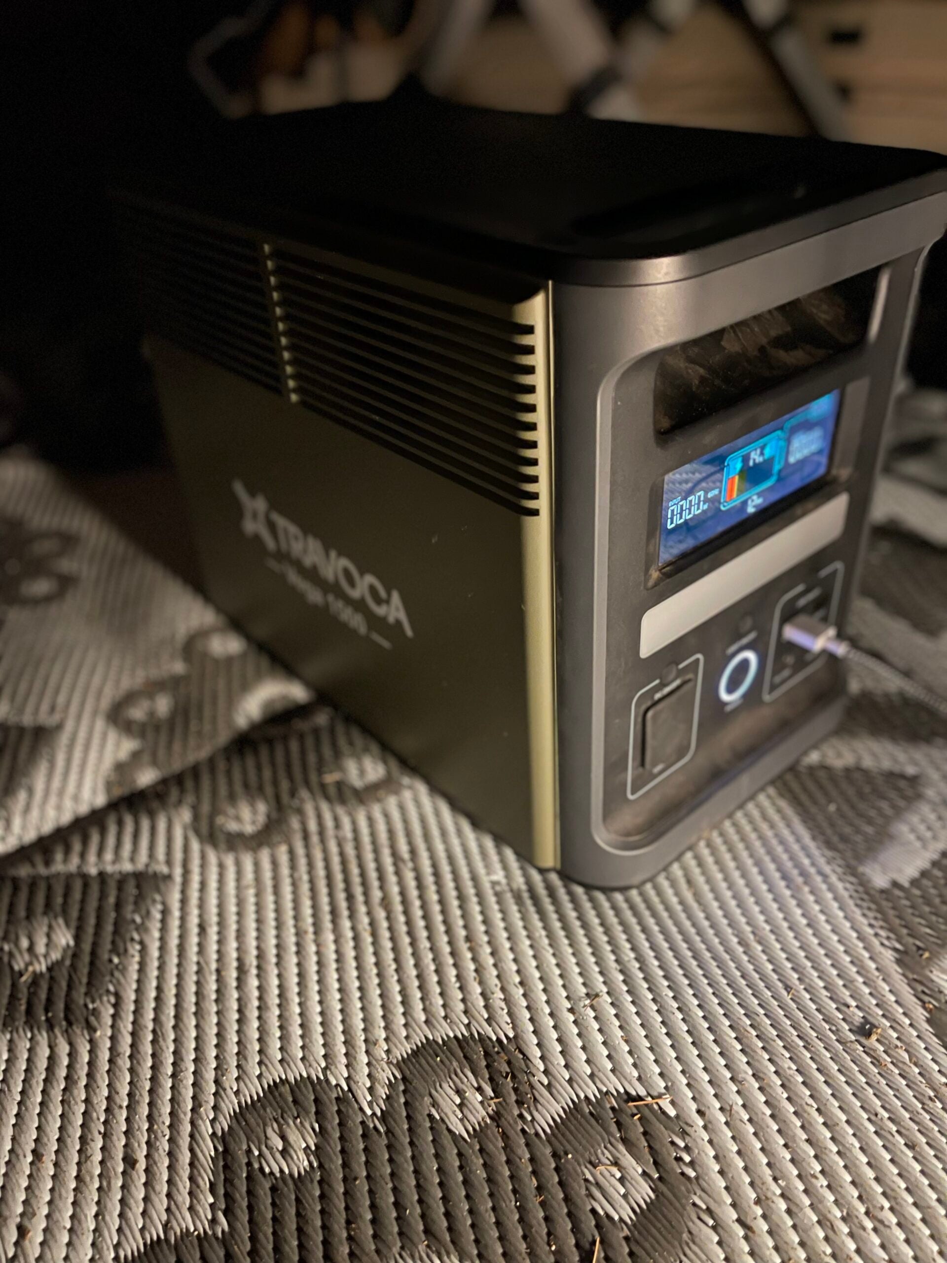 TRAVOCA Vega 1500 portable power station running indoors at night, providing quiet and reliable emergency backup power.